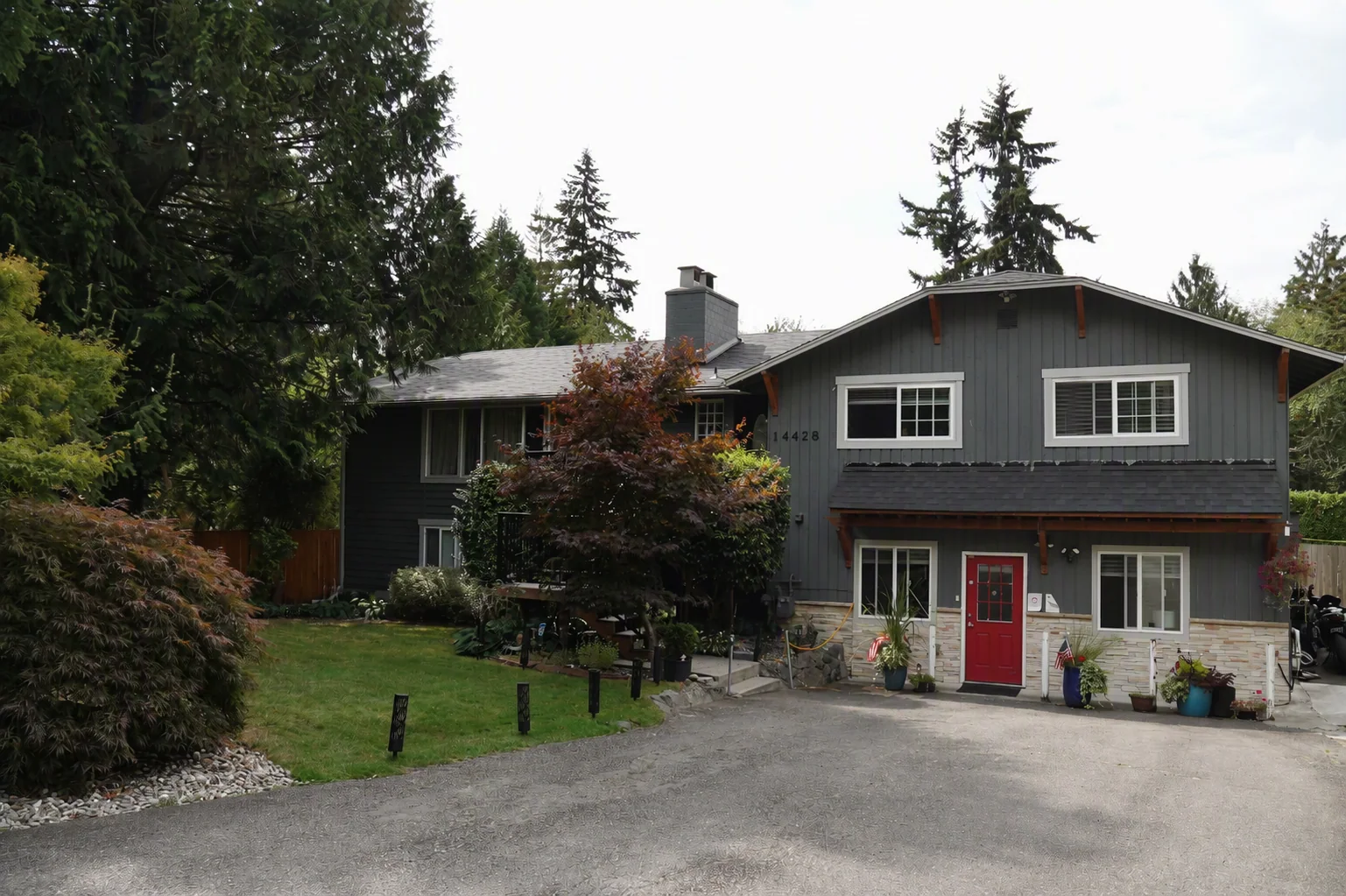 The front of Bear Care AFH II, with its red front door and driveway