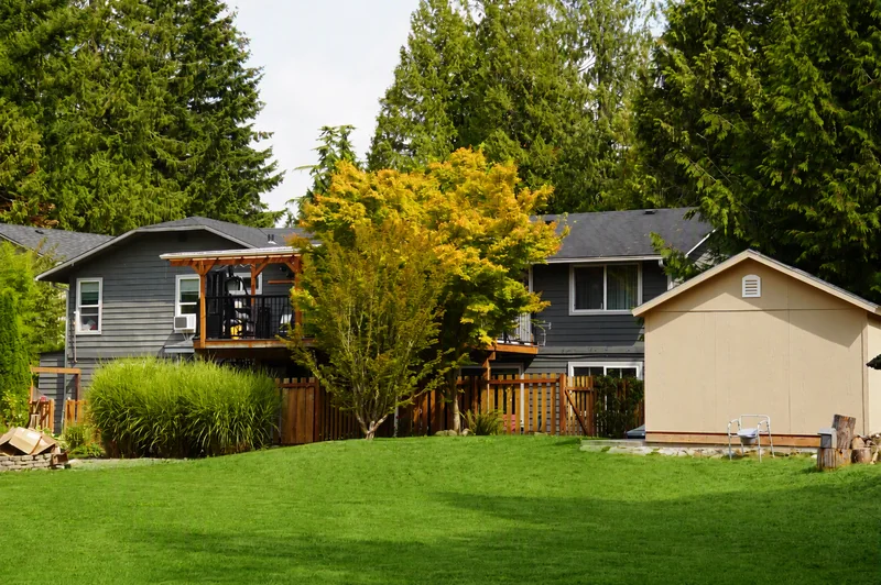 The back of the home seen across the lawn