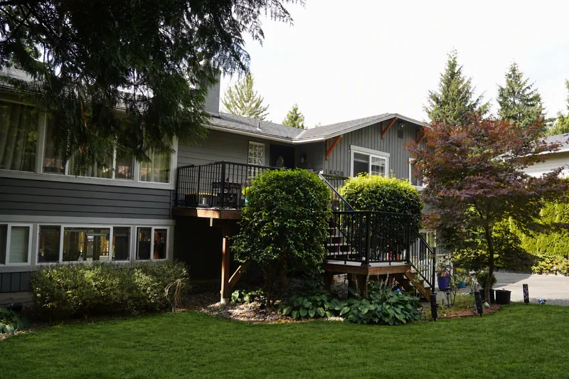 The side of the home with mature garden planting