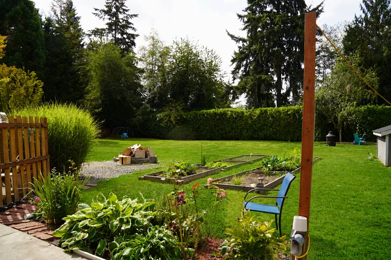 A bench and planting beds in the garden