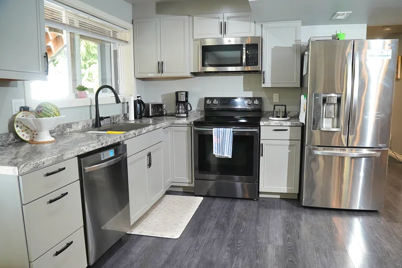 The kitchen at Bear Care AFH II, with a window above the sink