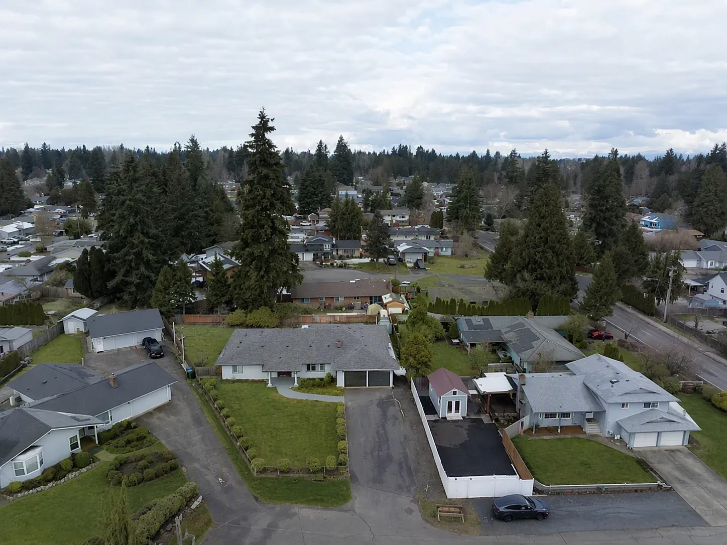 Aerial view of the quiet residential street around the home