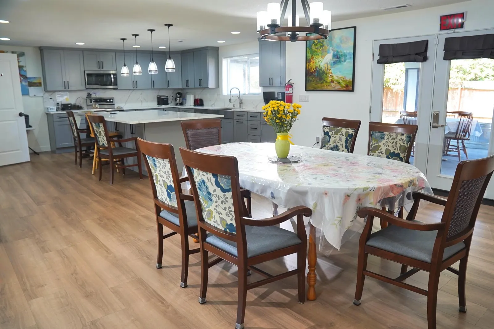 Dining table in an open-plan room beside the kitchen island