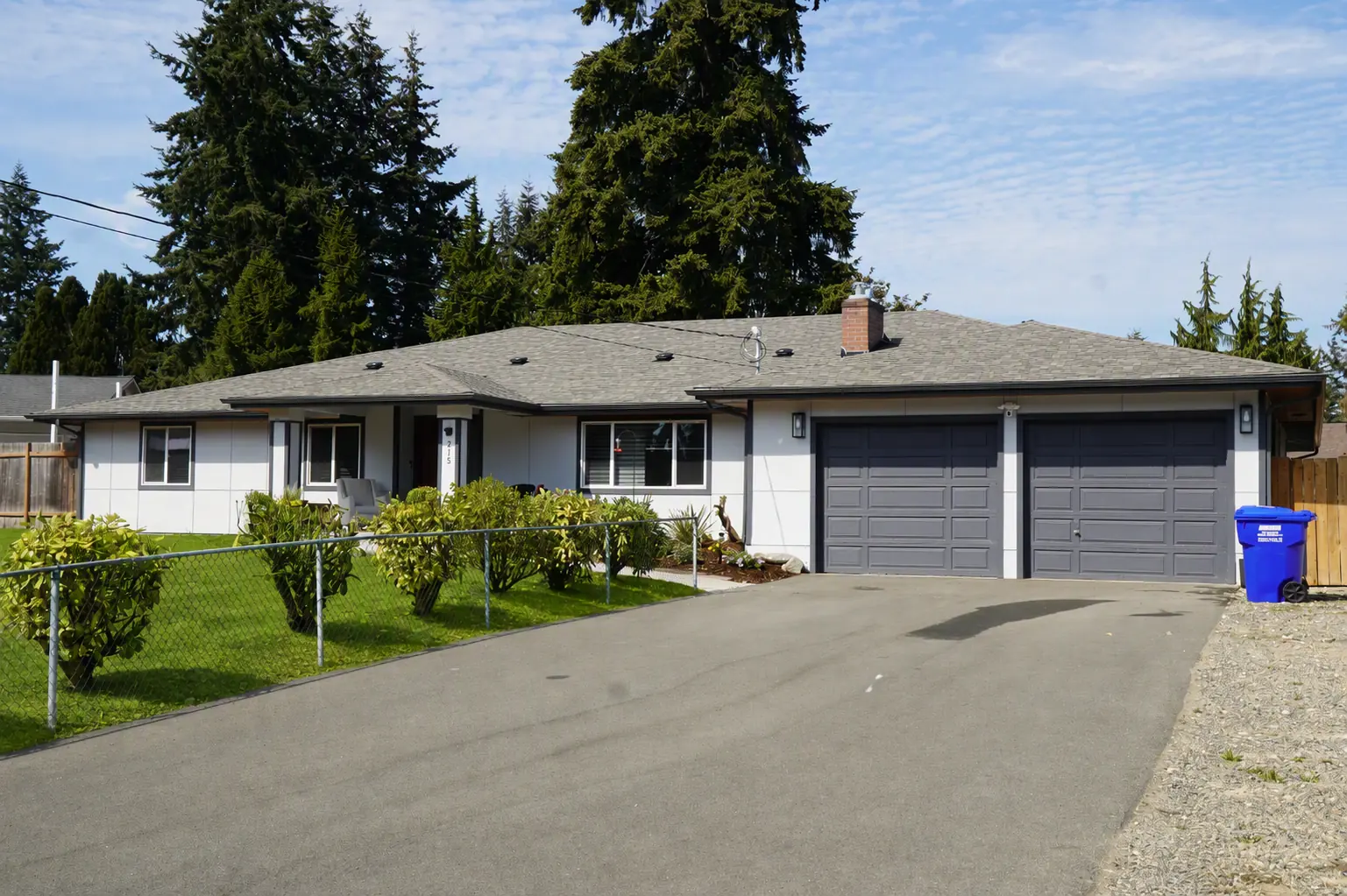 The house and driveway seen from the street